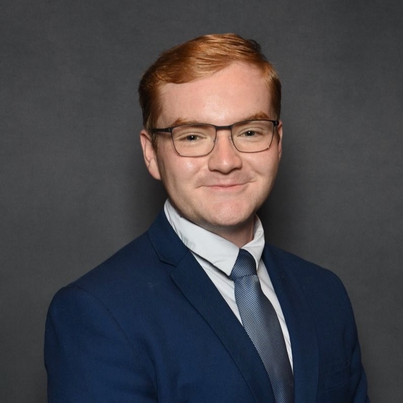 Clayton Herbst in a navy suit